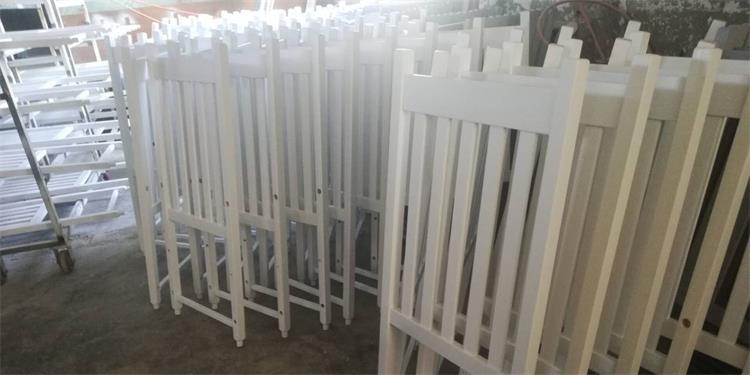 back of white rocking chairs